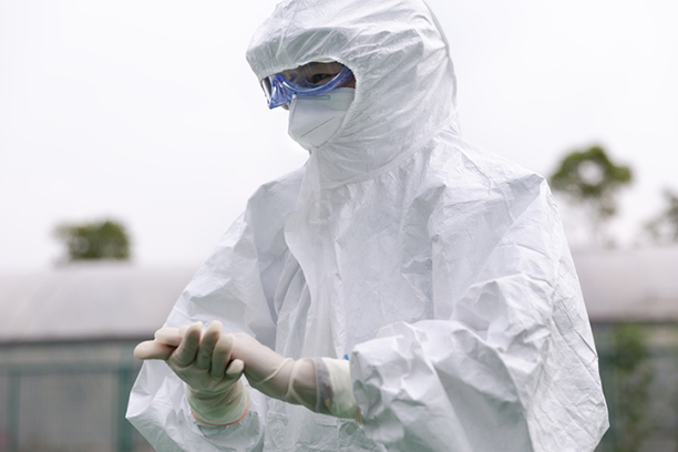 Worker in full PPE.