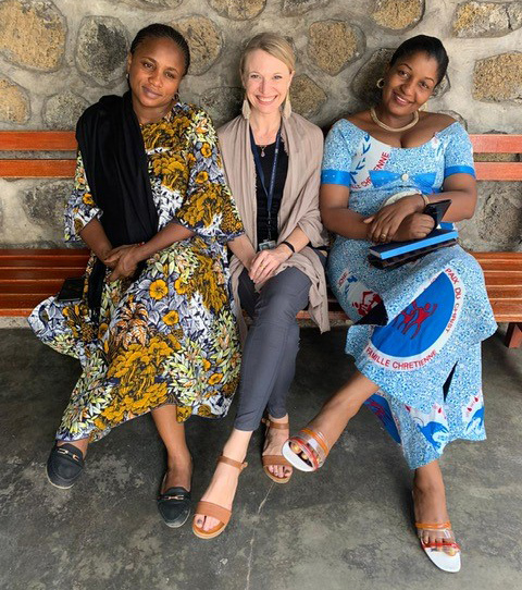 amanda-macgurn Health worker sitting with two people