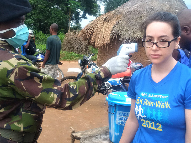 During West Africa’s 2014-2016 Ebola epidemic, Dana Schneider waits at a border health check point while the person behind her is screened. During West Africa’s 2014-2016 Ebola epidemic, Dana Schneider waits at a border health check point while the person behind her is screened.