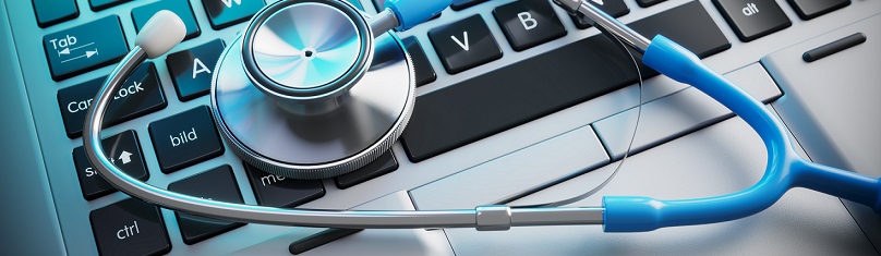 Stethoscope on laptop keyboard.