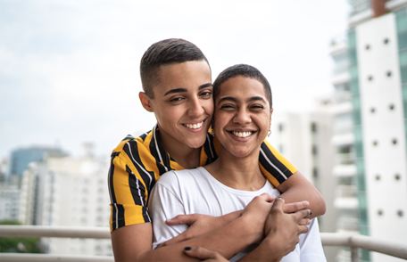 IPV_couple-on-balcony_456x294 Image of a smiling young couple embracing on a balcony