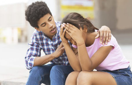 Young guy comforting his sad friend Young guy comforting his sad friend