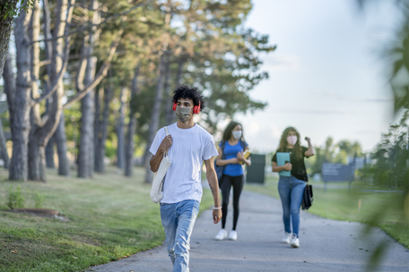 teens-walking_456x304 Image shows masked teens walking along a sidewalk