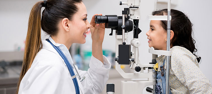 Doctor checking a child's vision