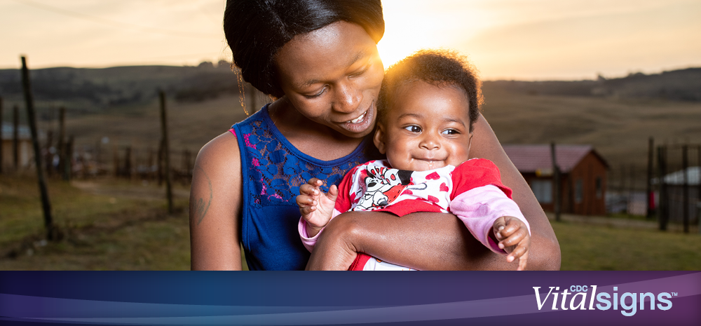 A photo of a woman holding a child.