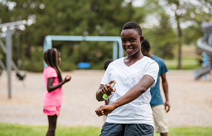 Insect repellent being sprayed onto a person's arm