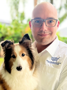 Miguel Abi-hassan, Chief Animal Rescue, pictured with a dog.