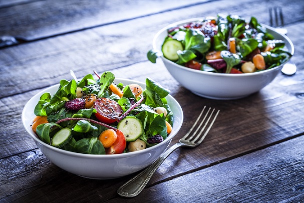 Two fresh salad bowls Two bowls of salad.