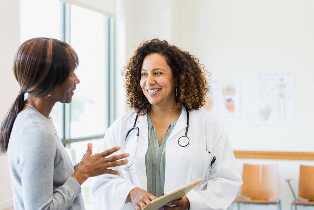 medical professional talking with patient