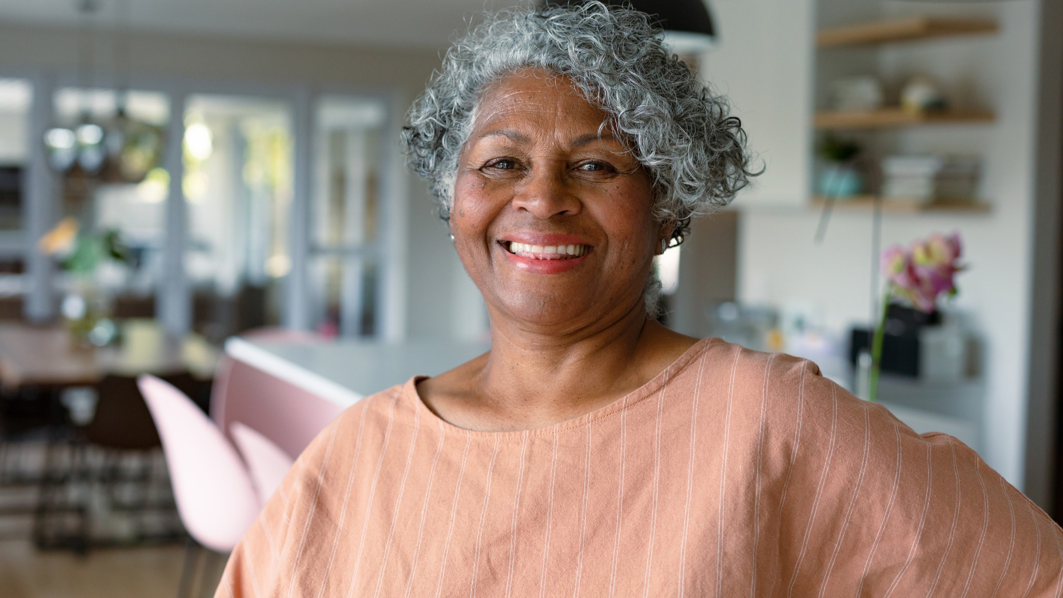 Chitlins An older adult standing in the kitchen indoors.