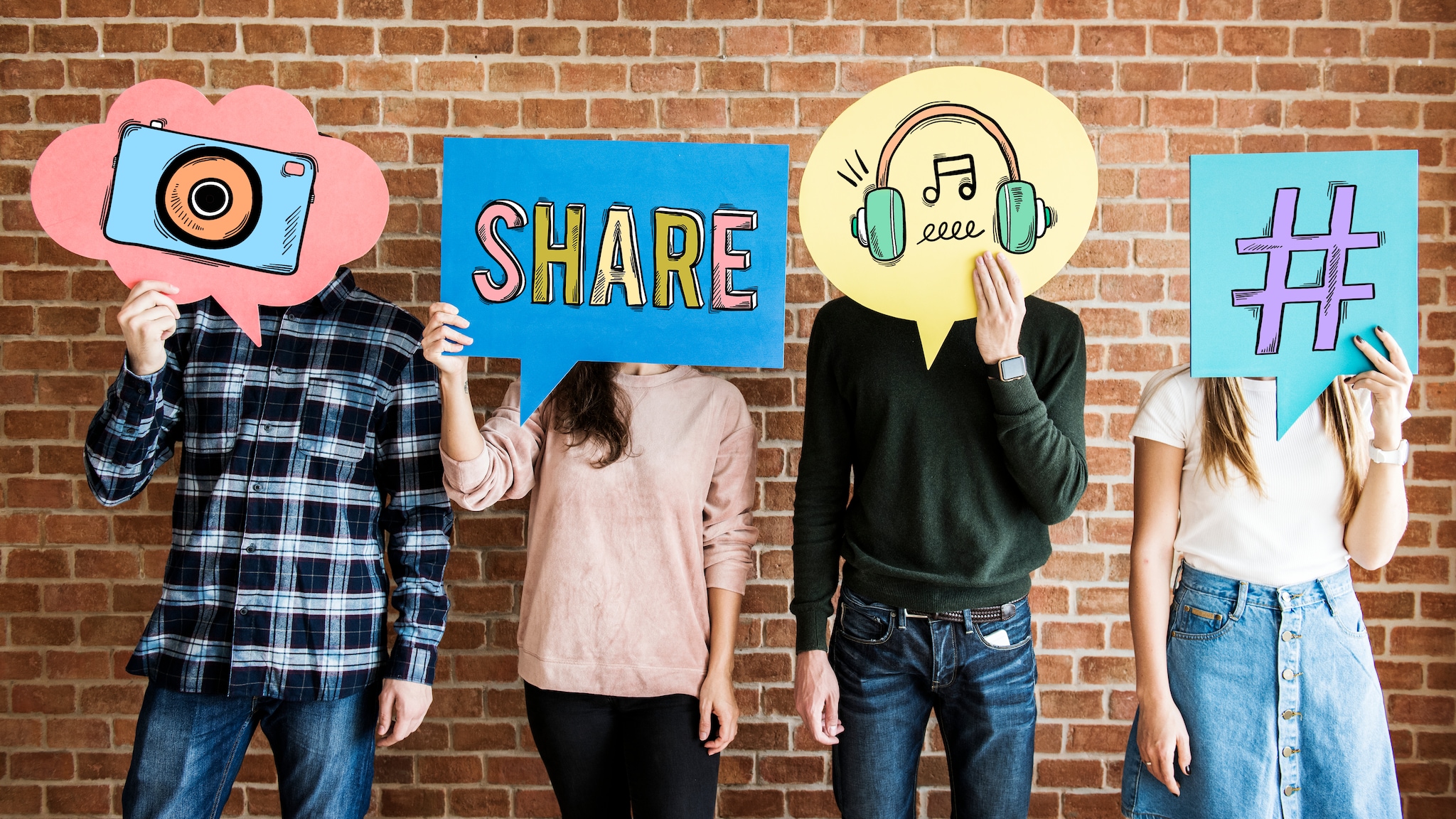 Four teens holding images in front of their faces, with each image representing a type of communication.